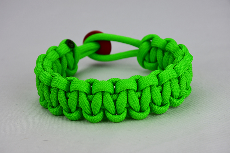 neon green paracord bracelet unity band w red button back