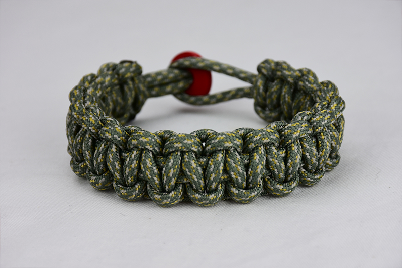 acu camouflage paracord bracelet unity band with red button back, picture of an acu camouflage paracord bracelet unity band with red button fastener in the back on a white background