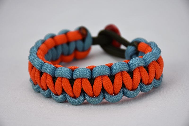 od green light blue and orange paracord bracelet unity band with red button, picture of a od green light blue and orange paracord bracelet with red button fastener on a white background, multi color paracord bracelet