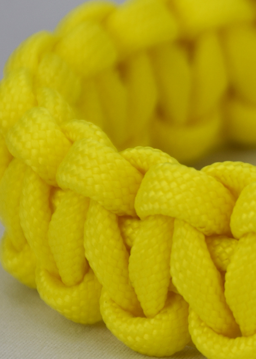 neon yellow paracord bracelet unity band, picture of a close up on a one color neon yellow paracord bracelet