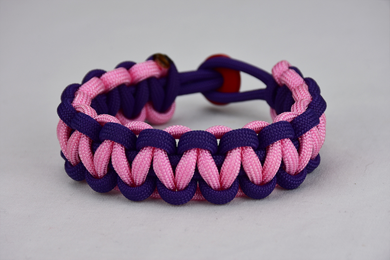 purple purple and soft pink paracord bracelet unity band with red button in back, picture of a purple purple and soft pink paracord bracelet unity band with red button fastener in the back on a white background