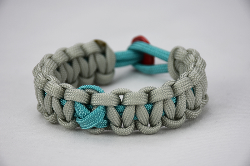 teal and grey ptsd support paracord bracelet with teal ribbon and red button, picture of a teal and grey ptsd support paracord bracelet unity band with a teal ribbon in the center and red button fastener
