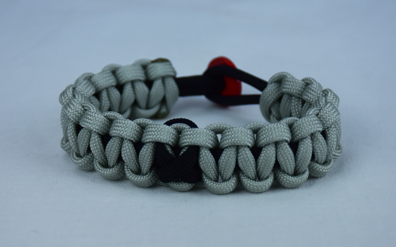 black and grey pow mia support paracord bracelet with red button back and black ribbon