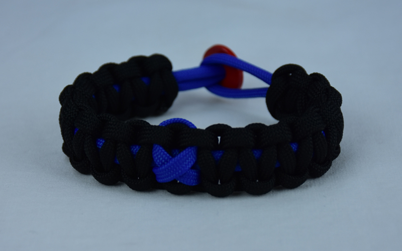 blue and black anti-bullying paracord bracelet with red button in the back and blue ribbon